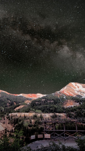 Milky Way over mountains with old mine structures