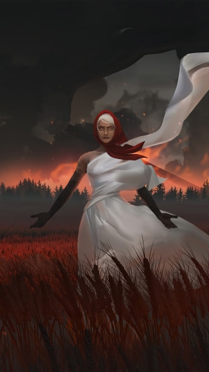 Woman in white dress with red headscarf in a field