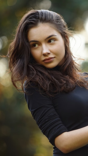 Model in black dress outdoors