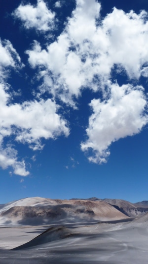 Desert landscape with mountains and clouds