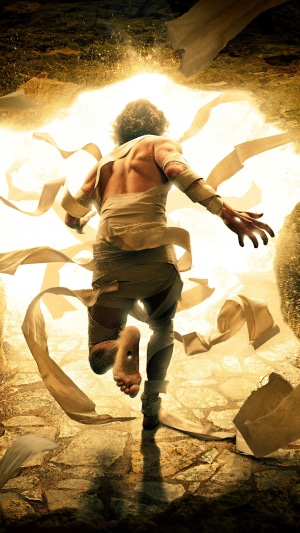 Man emerging from a tomb, wrapped in bandages