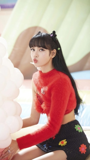 BLACKPINK's Lisa in red top and black skirt