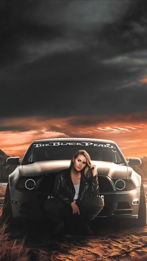 Girl posing in front of a car with "The Black Pearl" text