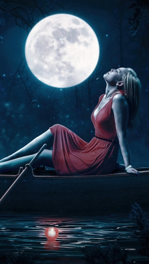Woman in red dress in a boat under the moon