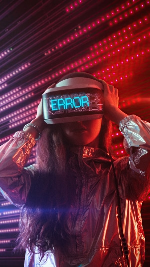Person wearing VR headset with ERROR message