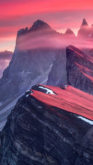 Mountains at sunset with pink clouds