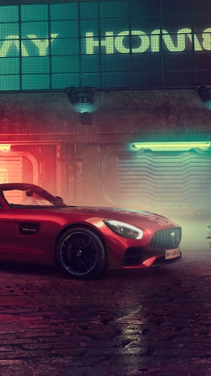 Red Mercedes-AMG GT R parked in a neon-lit alley