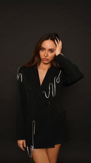 Jade Thirlwall in a black blazer with rhinestones