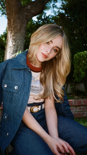 Sabrina Carpenter in a denim jacket and jeans
