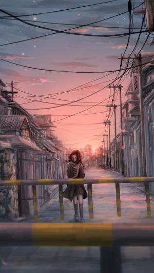 Girl walking down a street at sunset