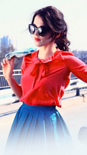 Sati Kazanova in red blouse and blue skirt