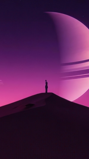 Silhouette on a Dune with a Ringed Planet