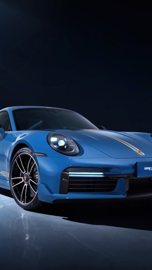 Blue Porsche 911 with gold stripes