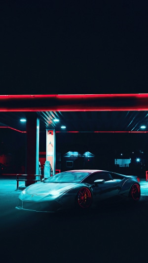 Lamborghini at a neon-lit gas station