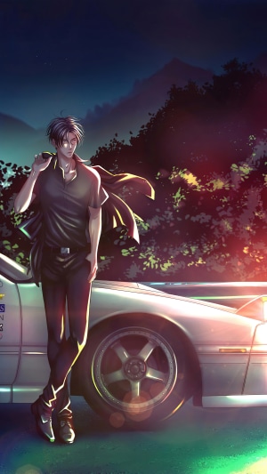 Man leaning on a car at night
