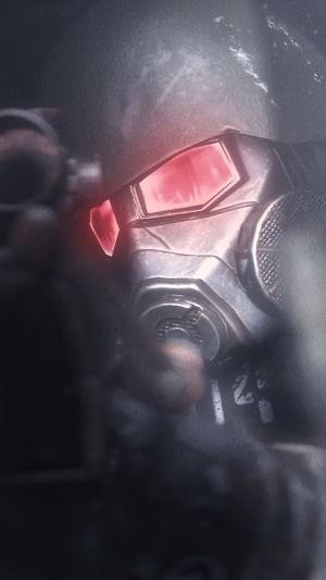 Man in gas mask with red glowing eyes