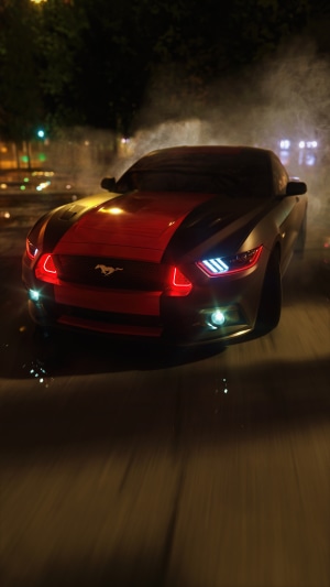 Ford Mustang with red stripes at night