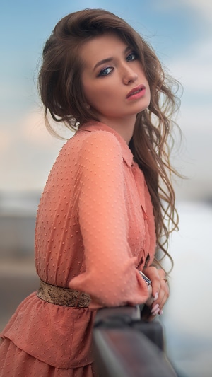 Brunette model in a pink dress