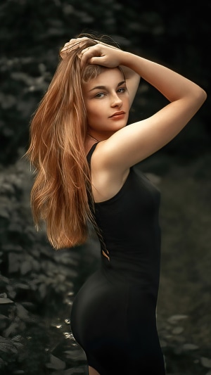 Model in black dress with long hair