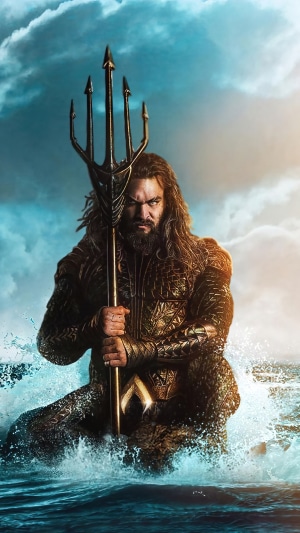 Aquaman holding a trident in the ocean