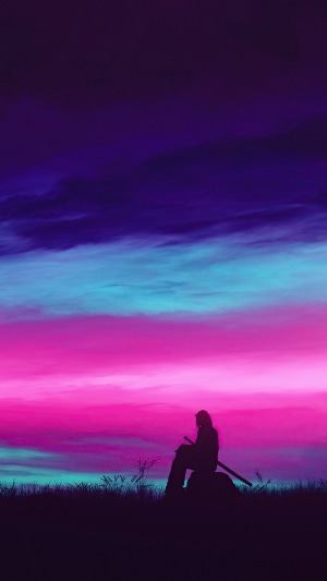 Silhouette of a person with a sword at sunset
