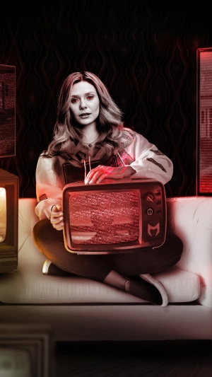 Scarlet Witch from Wanda Vision holding a TV