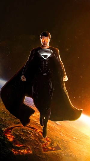 Superman in black suit with glowing eyes