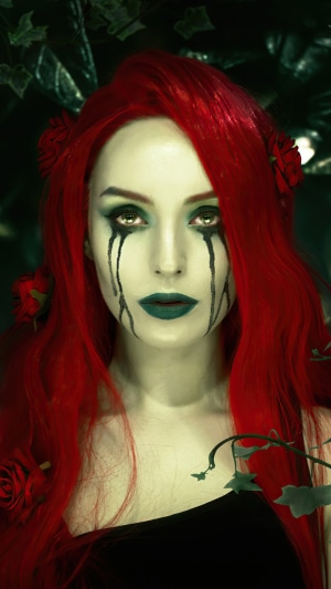 Poison Ivy cosplay with red hair and green makeup