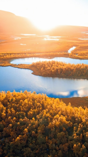 Sunrise over autumn landscape with lakes and trees
