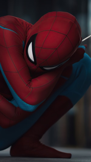 Spiderman in red and blue suit crouching