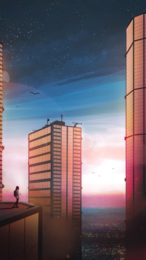 Person on rooftop overlooking city at night