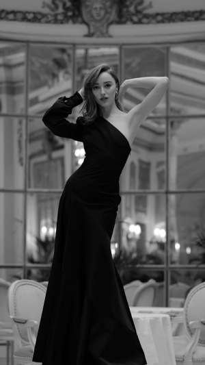 Phoebe Dynevor in a black dress
