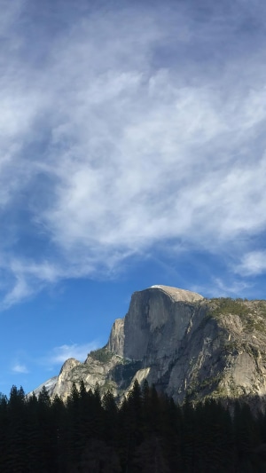 Half Dome mountain in Yosemite under a cloudy sky
