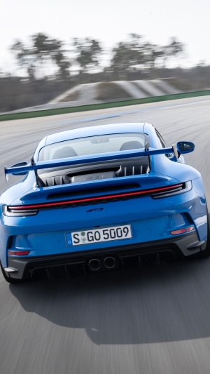 Blue Porsche 911 GT3 on a Racetrack