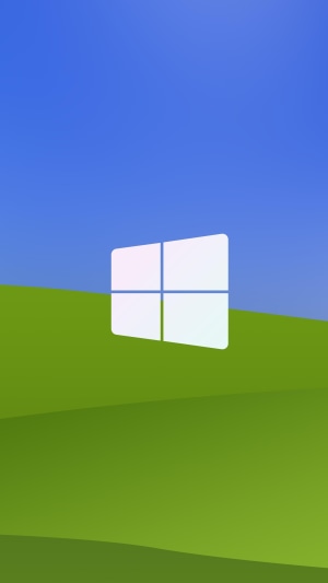 Windows logo on a green hill and blue sky