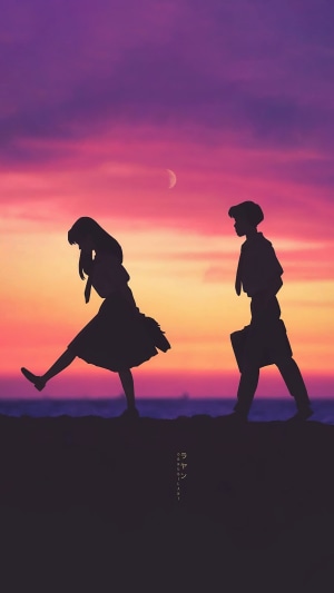 Couple walking at sunset