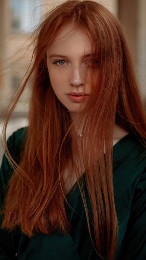 Redhead model in green dress