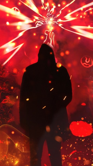 Hooded figure in front of red energy explosion