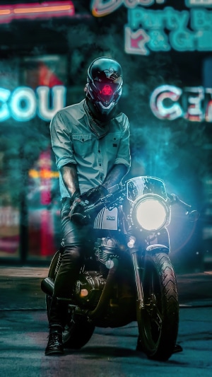 Biker in Sci-fi Helmet on Motorcycle