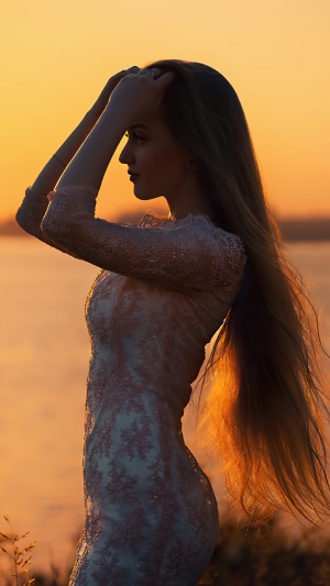 Girl in a dress at sunset