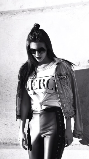 Victoria Justice in a denim jacket and leather pants