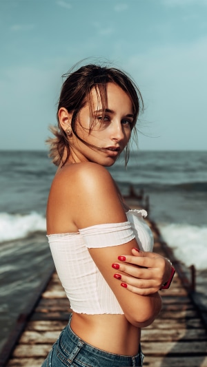 Woman on a pier by the ocean