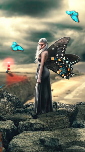 Fairy with butterfly wings and blue butterflies