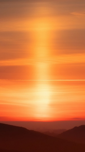 Orange sky with sunset over hills 4K