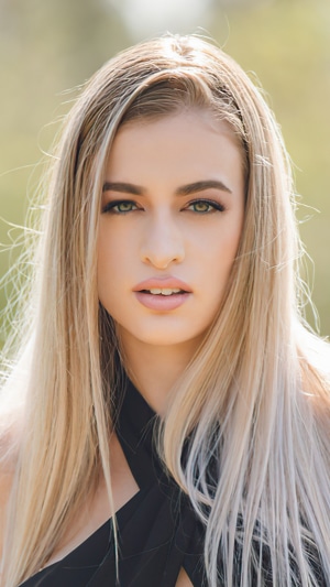Blonde model in black dress