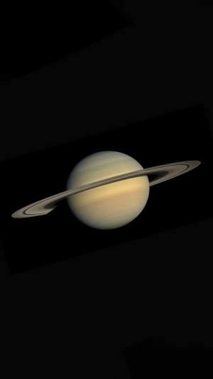 Saturn and its rings in space