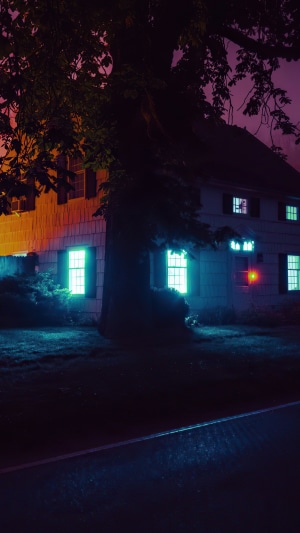 House with glowing windows at night