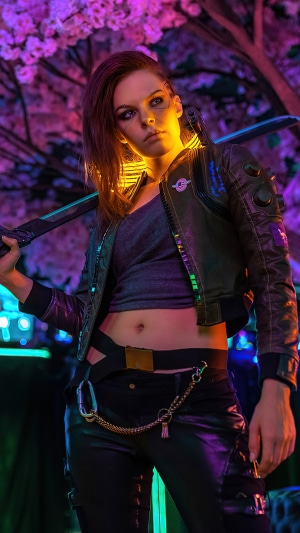 Woman in Cyberpunk 2077 cosplay with sword