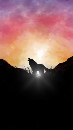 Silhouette of a wolf howling at sunset