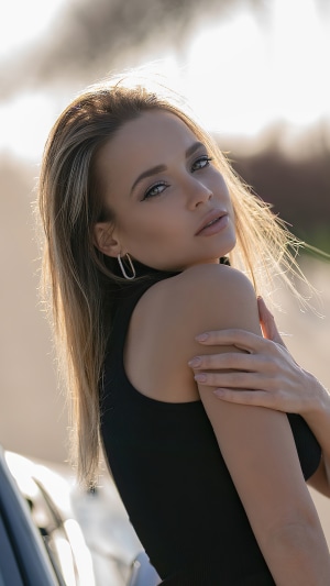 Blonde model in black top